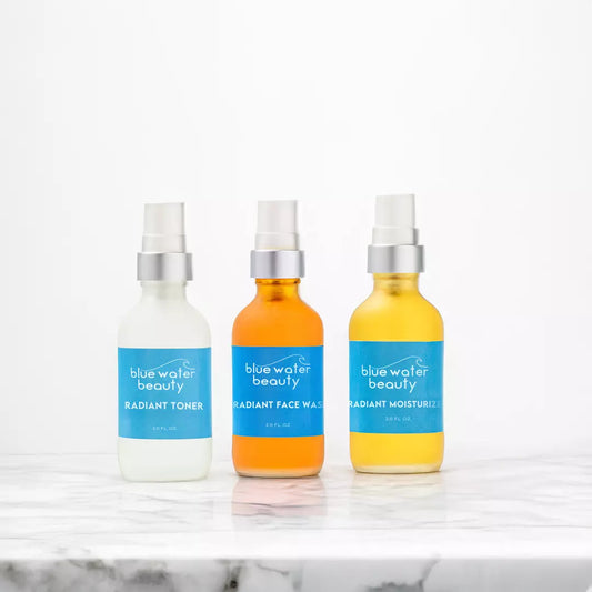 Three Bottles of Blue Water Beauty Sample Kit on Marble